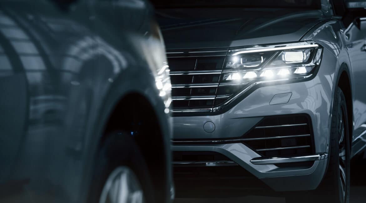 powerful headlights particle view modern luxury cars parked indoors daytime