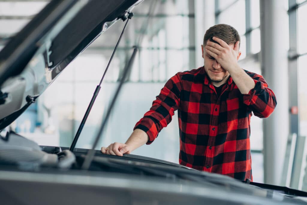 young man making diagnostics vehicle