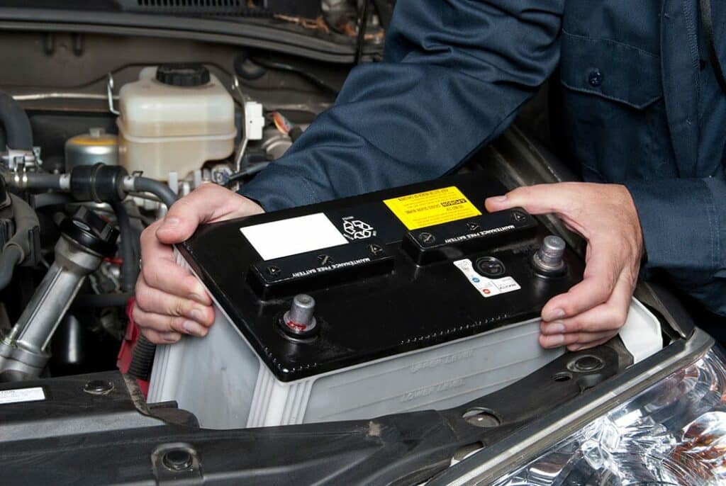 Auto mechanic replacing car battery 1024x686 2