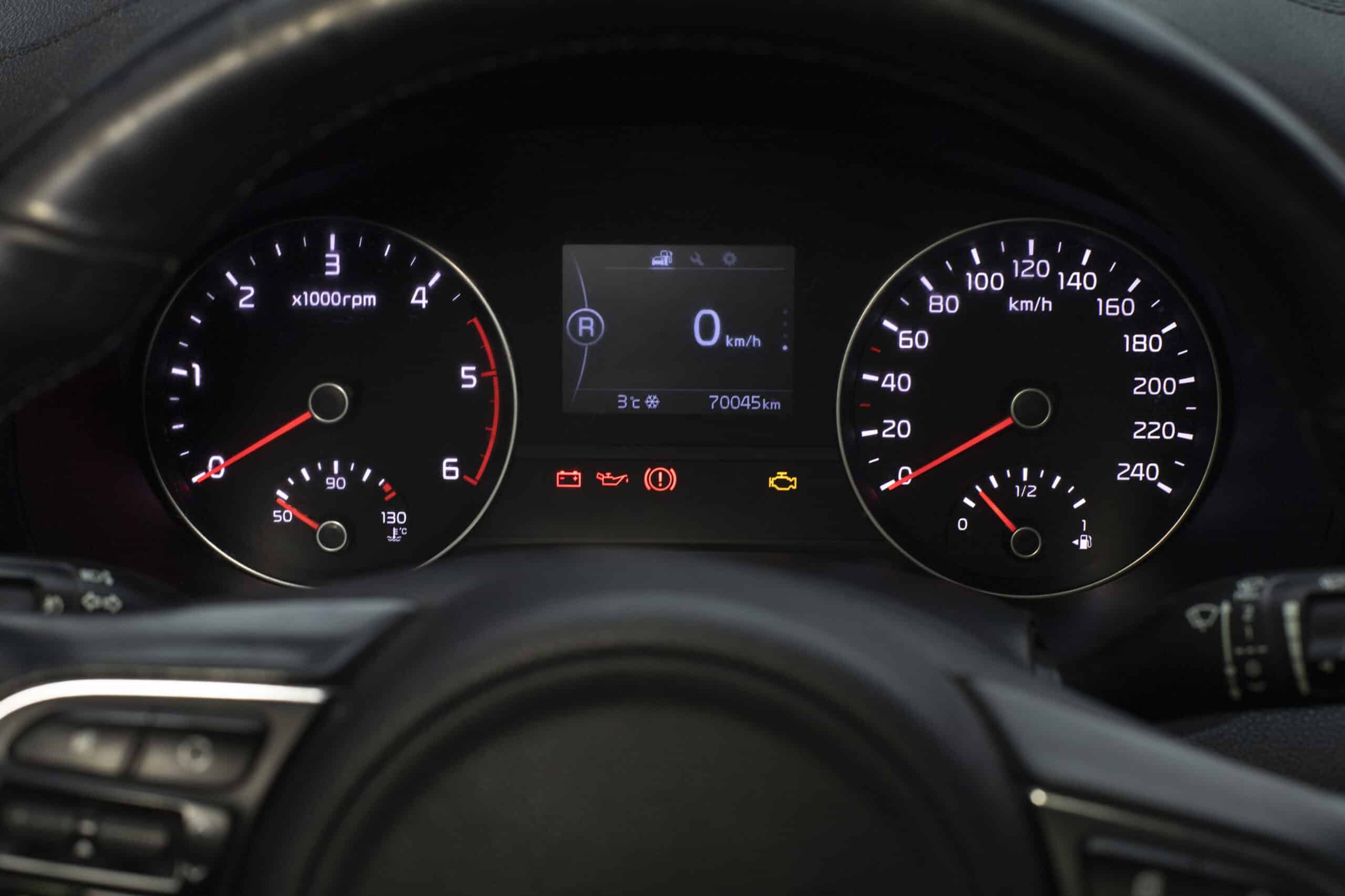Close-up of a vehicle's dashboard showing fuel level gauge, speedometer, and warning lights, relevant to check engine light diagnostics and auto repair guidance in Bay Shore, NY.