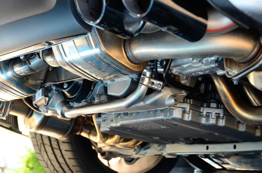 Exhaust system components including muffler and pipes, showcasing the importance of exhaust system repair and maintenance for vehicle performance.