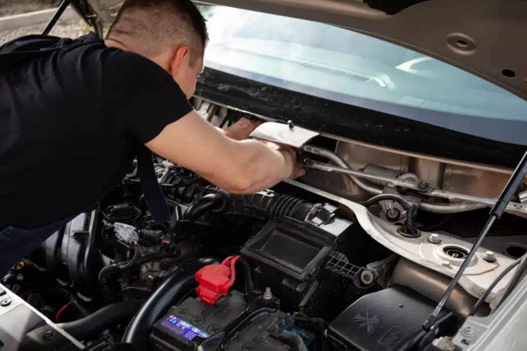 Mercedes-Benz technician performing engine diagnostics and repairs in Bay Shore.