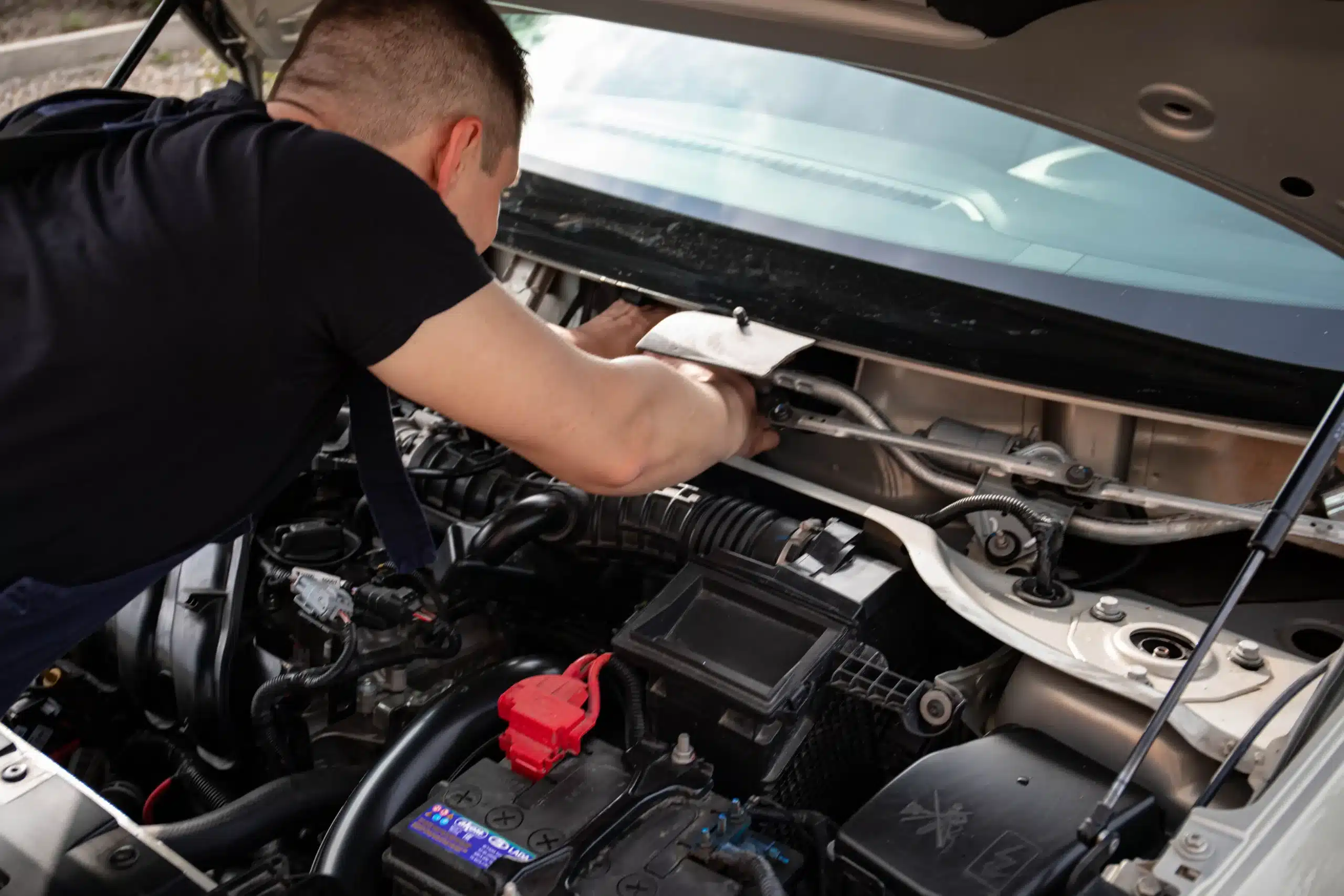 Mercedes-Benz technician performing engine diagnostics and repairs in Bay Shore.