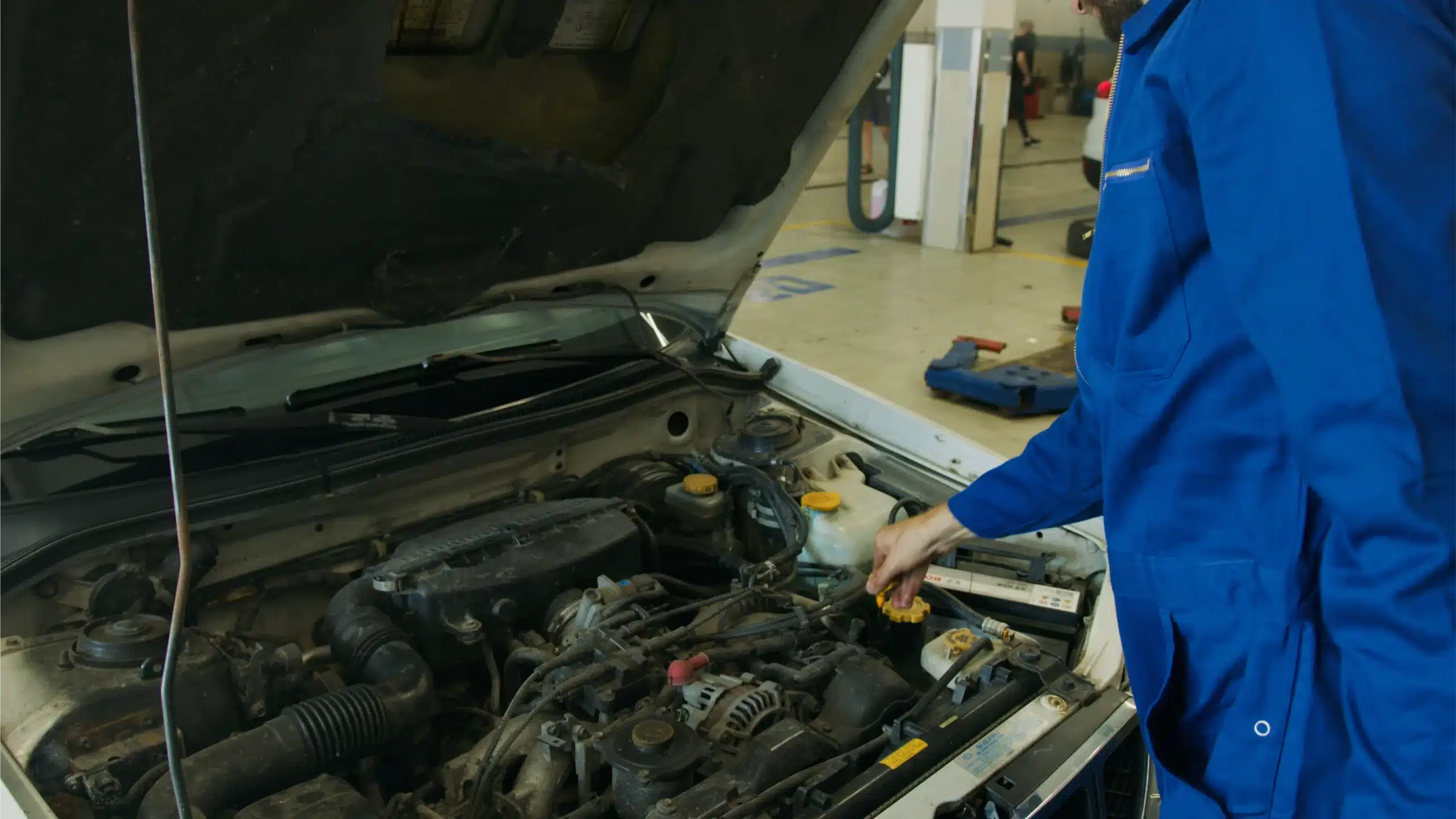 MB Automotive technician inspecting Volvo engine components and diagnostics.