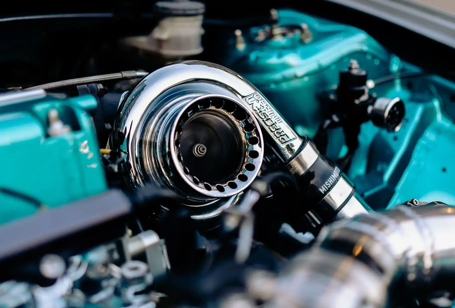 Turbocharger and performance components in a modern European vehicle engine.